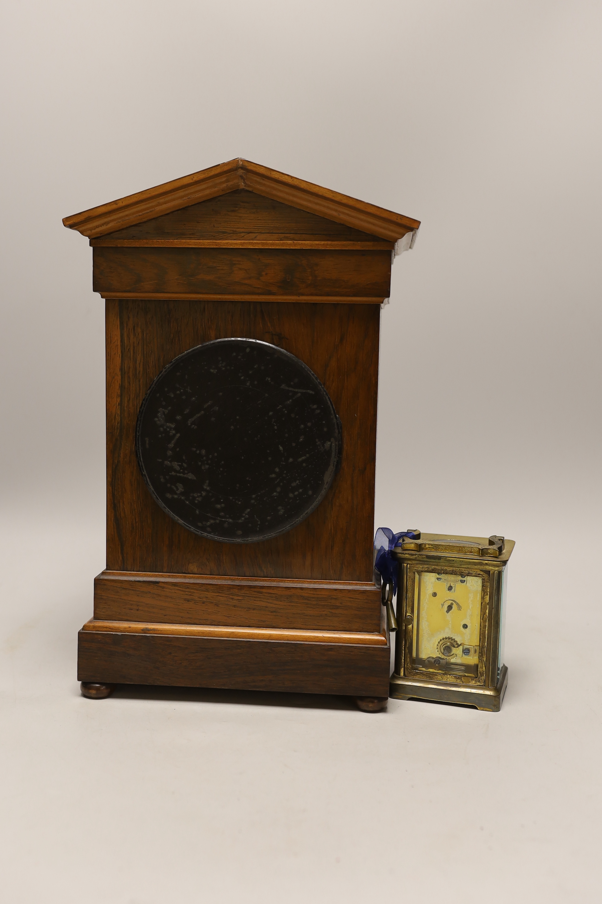 An Edwardian inlaid rosewood mantel clock and a carriage timepiece, tallest 36cm